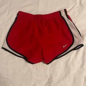 Red, white and black NIKE running shorts size small
